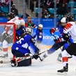GANGNEUNG, SOUTH KOREA - FEBRUARY 22: Canada's Haley Irwin #21 gets the puck past USA's Maddie Rooney #35 to score a second period goal with Monique Lamoureux-Morando #7, Lee Stecklein #2 and Canada's Natalie Spooner #24 looking on during gold medal round action at the PyeongChang 2018 Olympic Winter Games. (Photo by Matt Zambonin/HHOF-IIHF Images)

